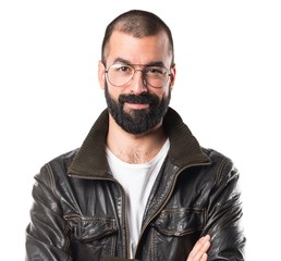 Man with leather jacket with his arms crossed