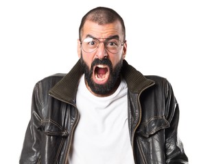 Man wearing a leather jacket shouting