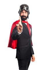 Super hero businessman counting one