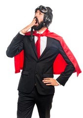 Super hero businessman yawning