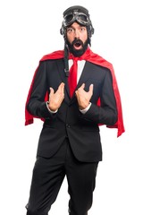 Super hero businessman doing surprise gesture