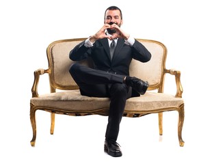 Businessman making a heart with his hands