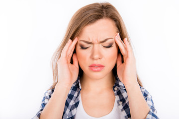 Tired young woman suffering from headache