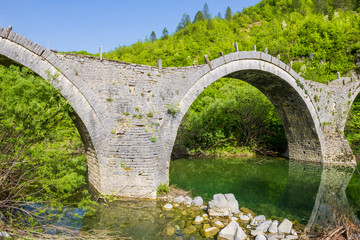 Fototapeta na wymiar Old stone bridge of Plakidas, kipoi (Greece)