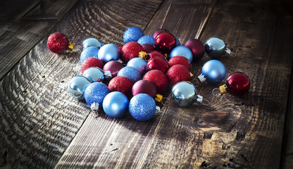 Christmas tree decorations in the form of spheres on wooden texture
