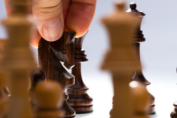 Man moving chess knight © mtsaride
