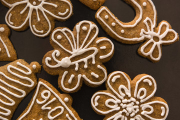 decorated gingerbread on baking sheet