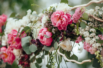 archway of many beautifil flowers, wedding arch with peones