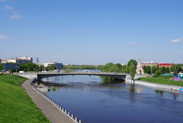 Fototapeta na wymiar Summer views of river Om, Jubilee bridge and Seraphimo-Alekseevskaya chapel, Omsk, Russia
