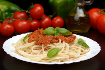 Spaghetti ragu alla bolognese sauce on black,close up
