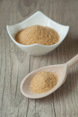 cane brown sugar in white bowl