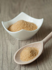 cane brown sugar in white bowl