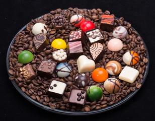 Set of a various chocolate pralines and coffee beans