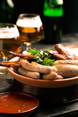 Plate of sausages and glass of beer