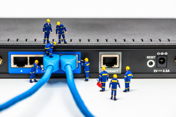 Group of engineers connecting fiber network cables