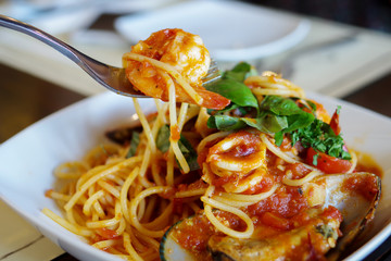 Eating spagetti seafood