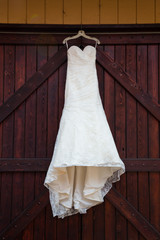 Fototapeta na wymiar White Wedding Dress Hanging Outdoors