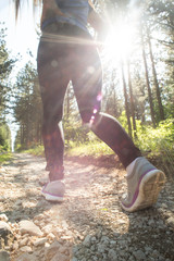 Sport shoes on trail walking in mountains, outdoors activity