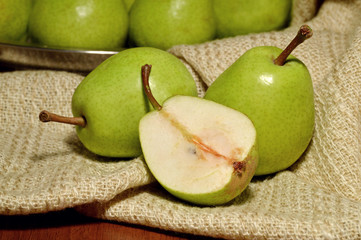 Several ripe pears and slice