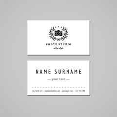 Photo studio business card design concept. Photo studio logo with photo camera and olive wreath. Vintage, hipster and retro style. Black and white.