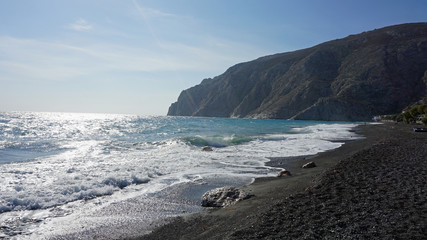 volcanic beach in kamari on santorini siland