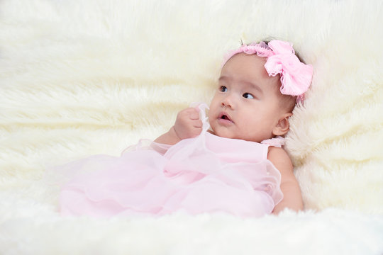 Baby dressed in a beautiful princess in the living room.
