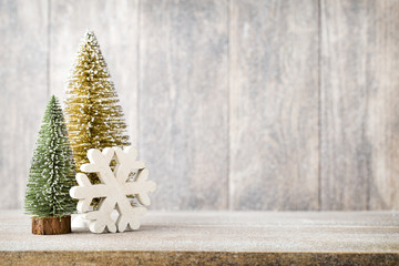 Christmas fir branch and decor, on the wooden background.