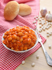 Fototapeta na wymiar Baked beans with tomatoes and garlik