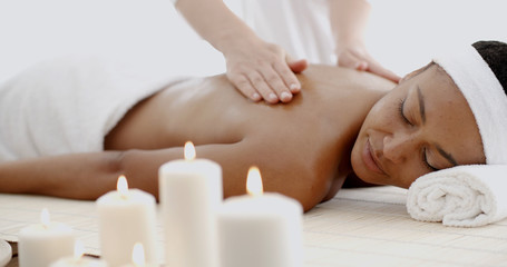Fototapeta na wymiar Young Woman Having A Massage In A Spa