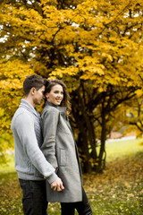 Young couple in the autumn park