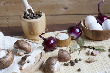 Fresh eggs with champignon mushrooms, vegetables and spices