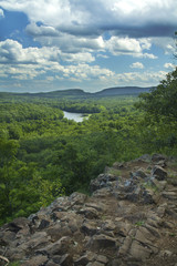 Hart Ponds below ridge of Ragged Mountain on a sunny summer day, Berlin, Connecticut, vertical image.