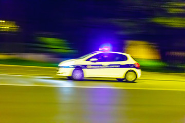 Fototapeta na wymiar Speeding police car