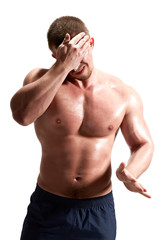 Fototapeta premium Athlete wipes the sweat from his forehead