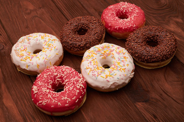 six colorful donuts