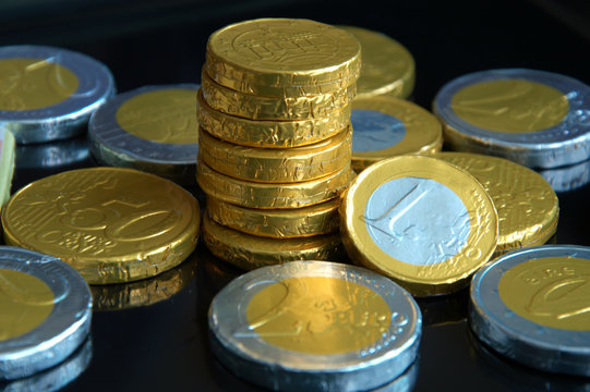 chocolate coins with black background
for good luck ,rich and wealthy