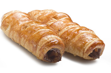 Italian cannoli filled with egg custard on white background