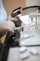 Hands of a dental lab technician working
