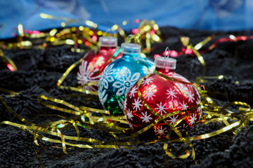 Fototapeta premium Christmas decoration on black velvet with a blue backdrop