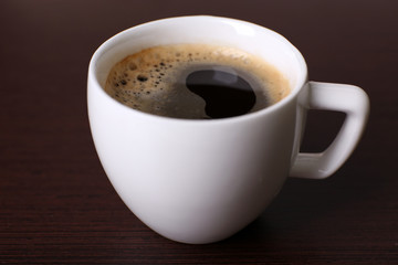 Cup of coffee on table close up