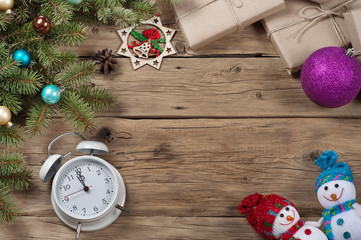 Branch of a Christmas tree, alarm clock, toys, Christmas present