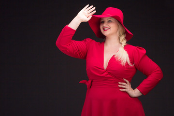 Sexy plus size woman in red hat with red lips.