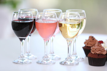 Tasting of wine and chocolate cupcakes, close up