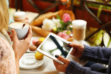 Woman taking photo of food in cafe