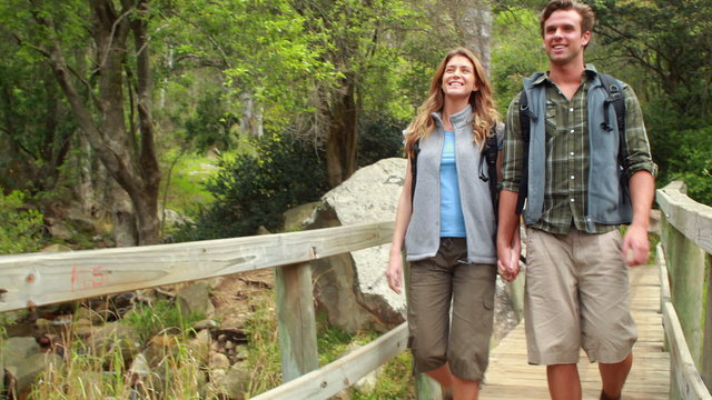 Young happy hiker couple hiking