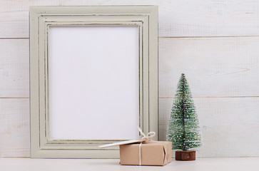 Christmas and New Year background. Empty picture frame, fir and vintage gift box with with copy...
