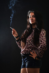 Woman Smoking a Cigarette on Black Background