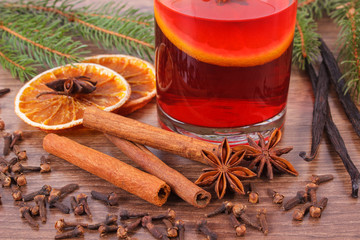 Mulled wine for christmas or winter evening with spices and spruce branches