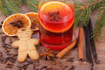 Mulled wine and gingerbread for christmas with spices and spruce branches