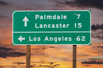Foto op Plexiglas Palmdale, Lancaster and Los Angeles Highway Sign with Sunset Sky © trekandphoto